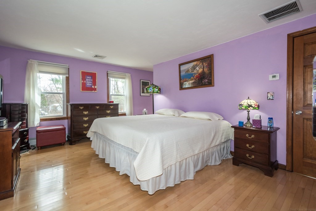148 Walker Road Shirley, MA 01464 - Photo 17 of 35 a bedroom with a bed and a dresser