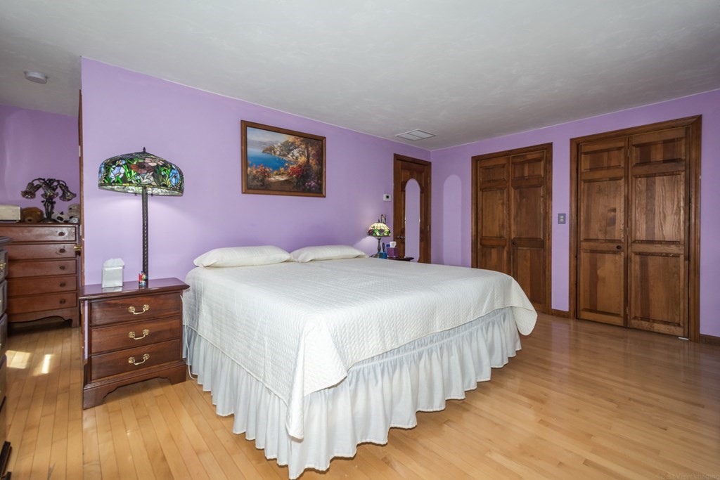 148 Walker Road Shirley, MA 01464 - Photo 18 of 35 a bedroom with a bed and a dresser