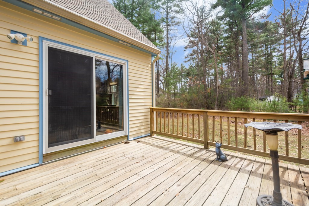 148 Walker Road Shirley, MA 01464 - Photo 26 of 35 a view of backyard with wooden floor and fence