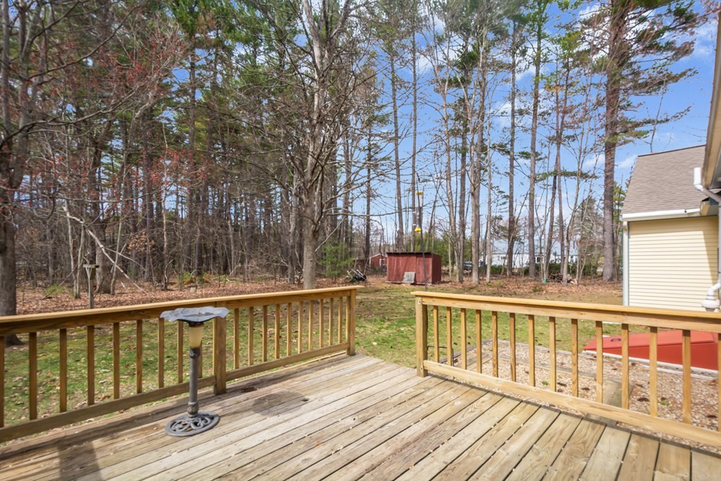 148 Walker Road Shirley, MA 01464 - Photo 27 of 35 a view of a balcony with wooden floor and fence