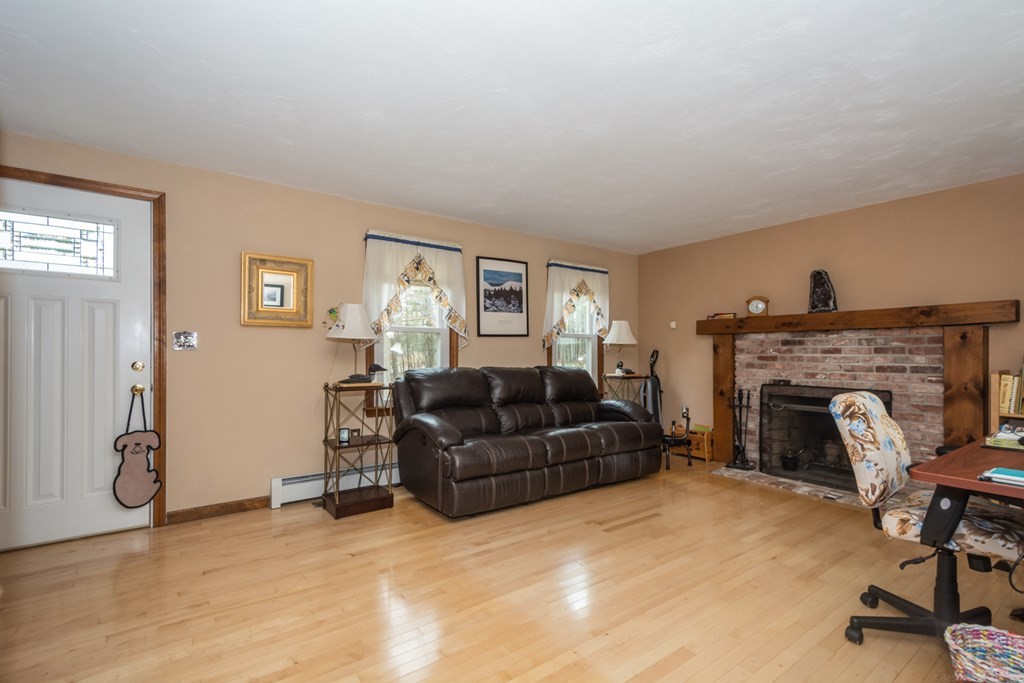148 Walker Road Shirley, MA 01464 - Photo 3 of 35 a living room with furniture and a fireplace