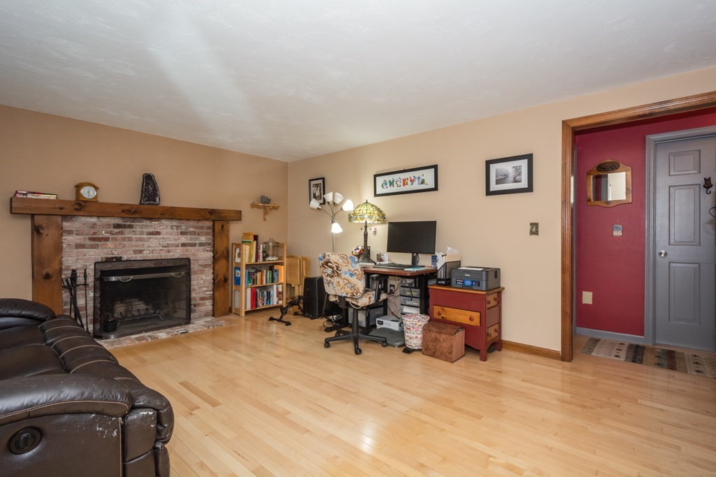 148 Walker Road Shirley, MA 01464 - Photo 4 of 35 a living room with furniture and a fireplace