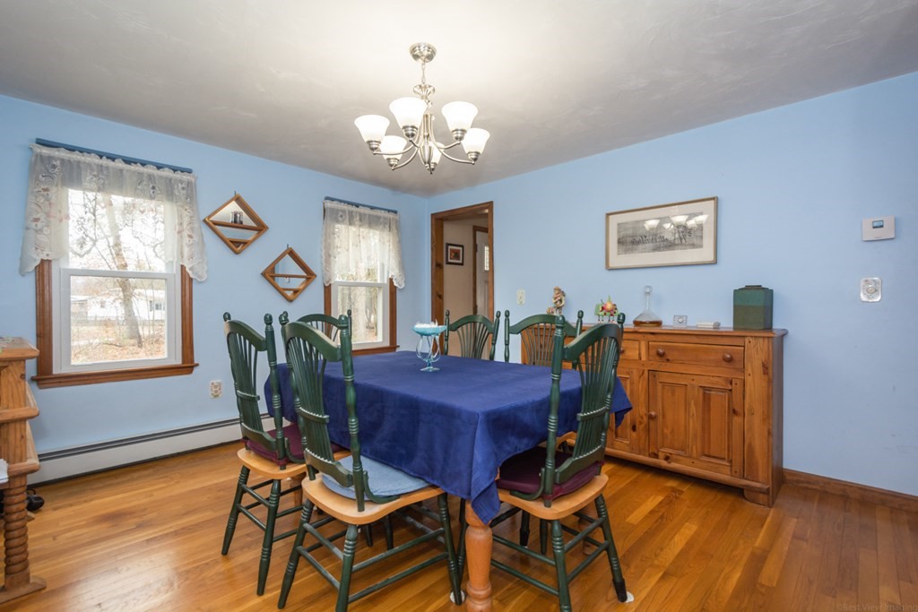 148 Walker Road Shirley, MA 01464 - Photo 6 of 35 a view of a dining room with furniture and a chandelier