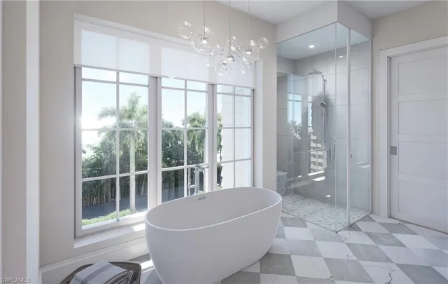 a spacious bathroom with a bathtub and shower