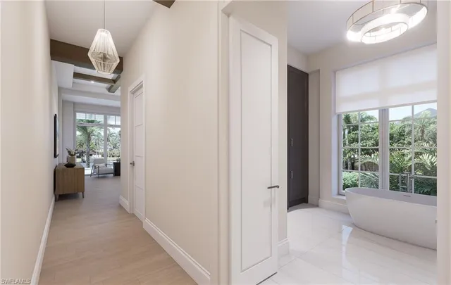 a view of a livingroom with furniture and windows