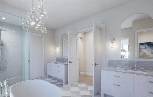 a spacious bathroom with a granite countertop sink a toilet and shower