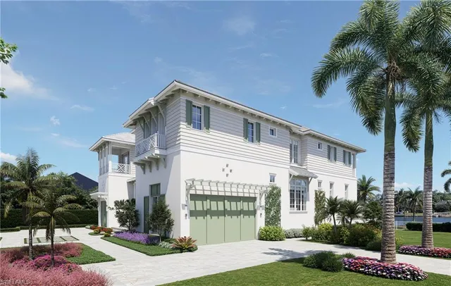 a front view of a house with yard and green space