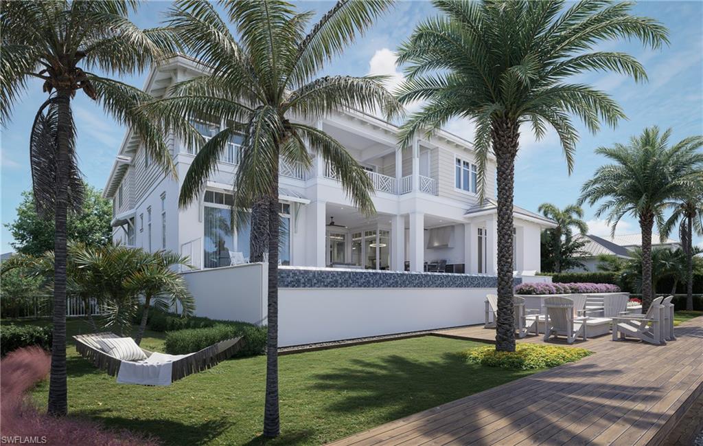 408 16th Avenue South Naples, FL 34102 - Photo 23 of 25 a front view of house with yard and green space