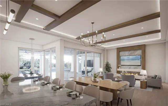 a room with lots of furniture and chandelier