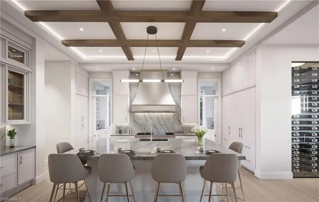 a view of a dining room with furniture and a chandelier