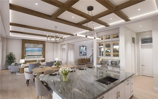 a living room with lots of furniture and a chandelier