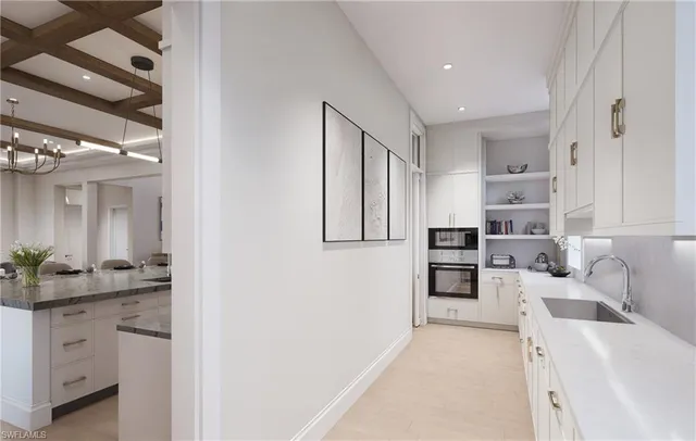 a kitchen with cabinets and refrigerator