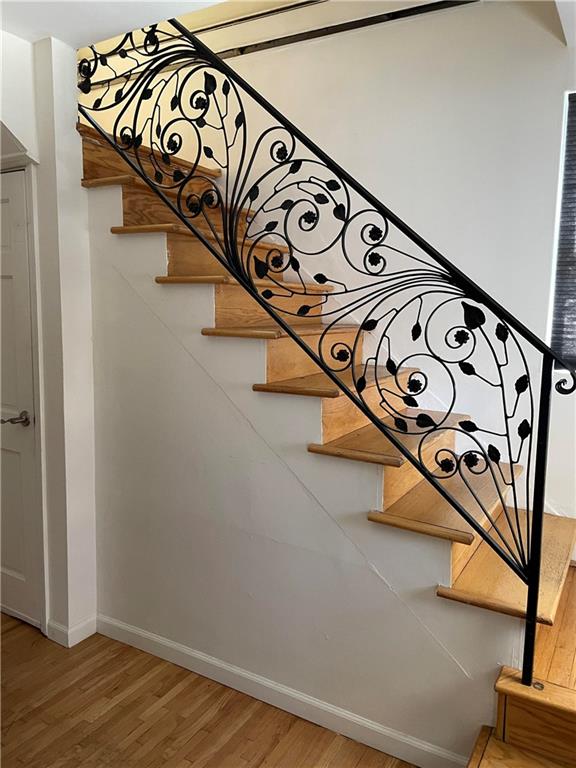 45 Brighton 2nd Place Brooklyn, NY 11235 - Photo 9 of 17 a view of a sign board with wooden floor