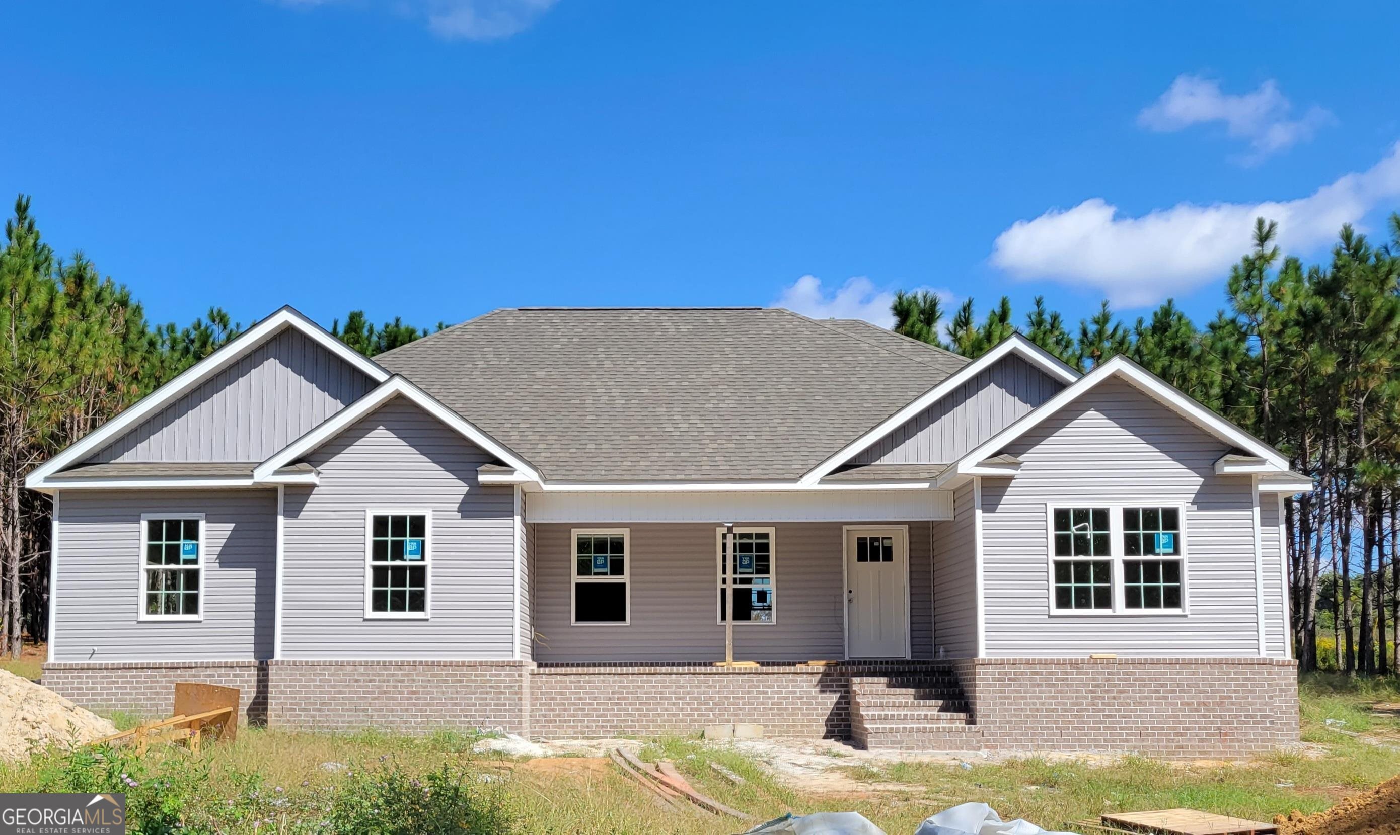 a front view of a house with a yard