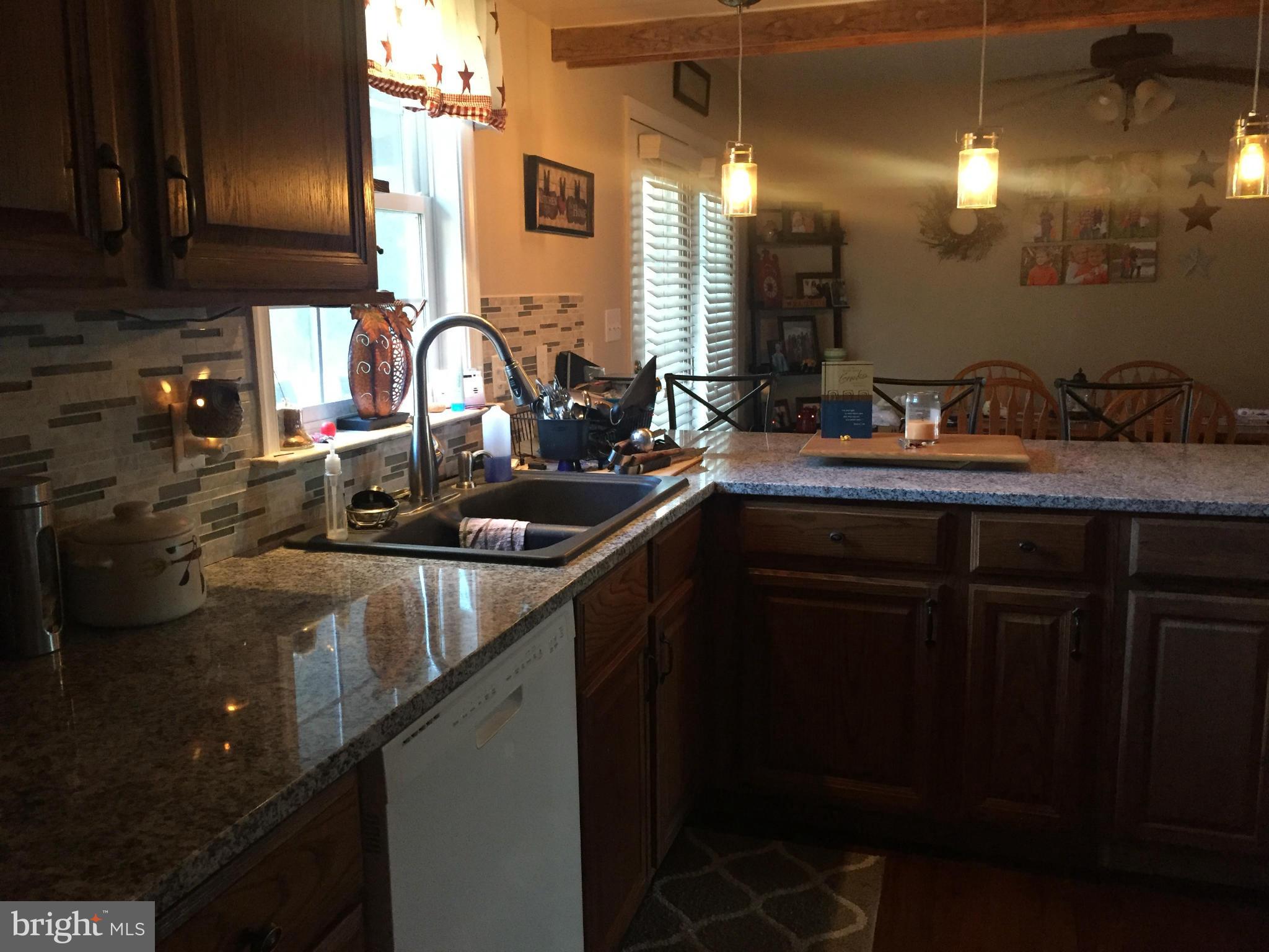289 Bluff Road Strasburg, VA 22657 - Photo 14 of 29 a kitchen with a sink and cabinets