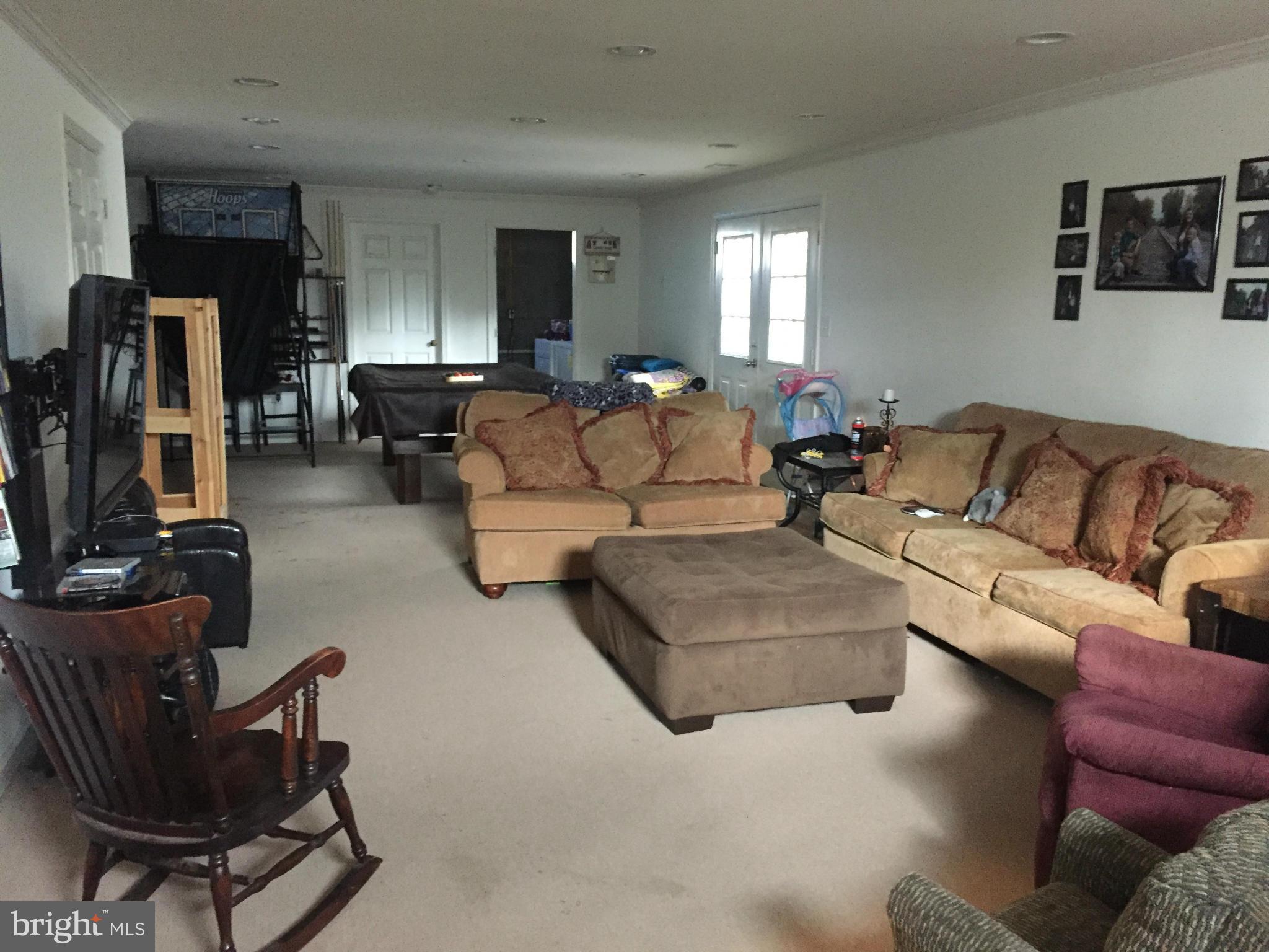 289 Bluff Road Strasburg, VA 22657 - Photo 22 of 29 a living room with furniture and a flat screen tv