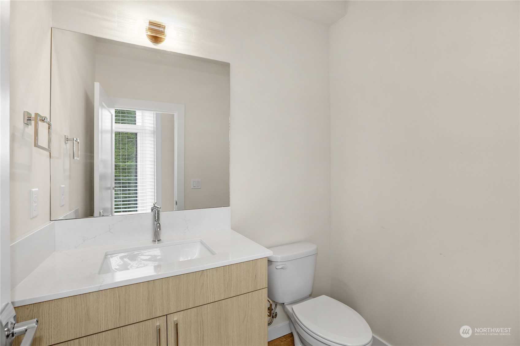 14493 Cedar Grove Road Southeast, Unit D102 Issaquah, WA 98027 - Photo 11 of 23 a bathroom with a granite countertop sink and a toilet