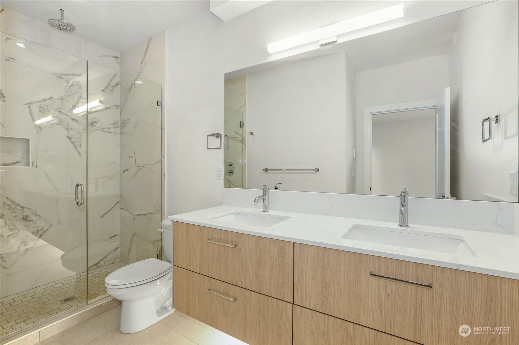 14493 Cedar Grove Road Southeast, Unit D102 Issaquah, WA 98027 - Photo 14 of 23 a bathroom with a sink toilet and shower