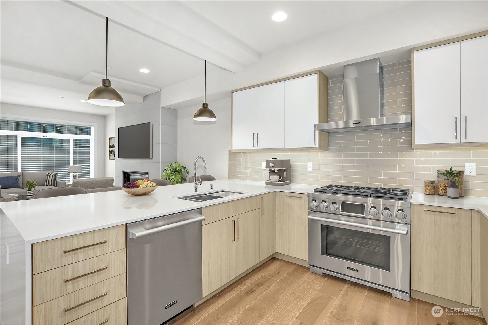 14493 Cedar Grove Road Southeast, Unit D102 Issaquah, WA 98027 - Photo 5 of 23 a kitchen with a stove sink and cabinets