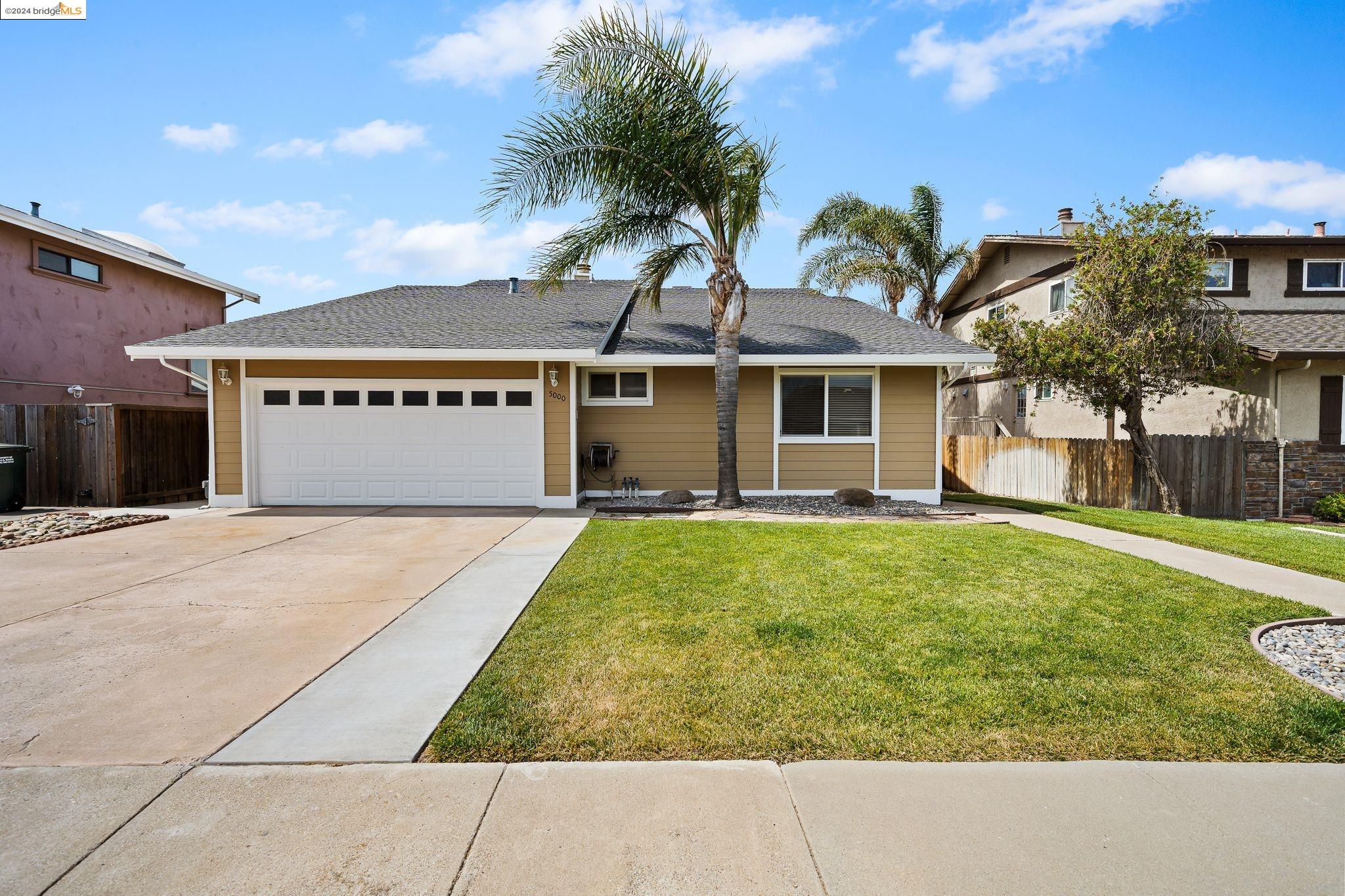 5000 Discovery Point Discovery Bay, CA 94505 - Photo 1 of 1 a front view of a house with a yard
