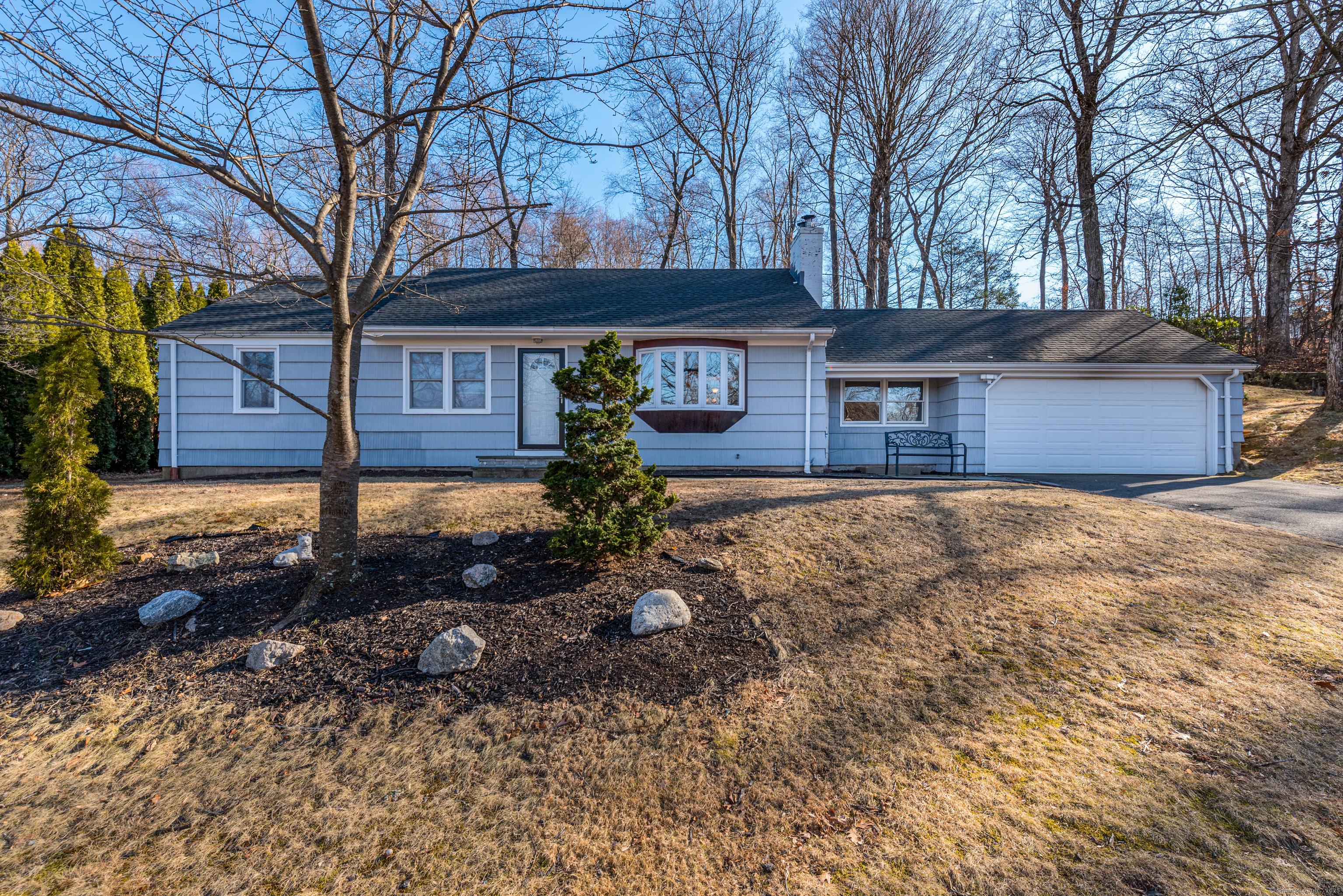 a front view of a house with garden