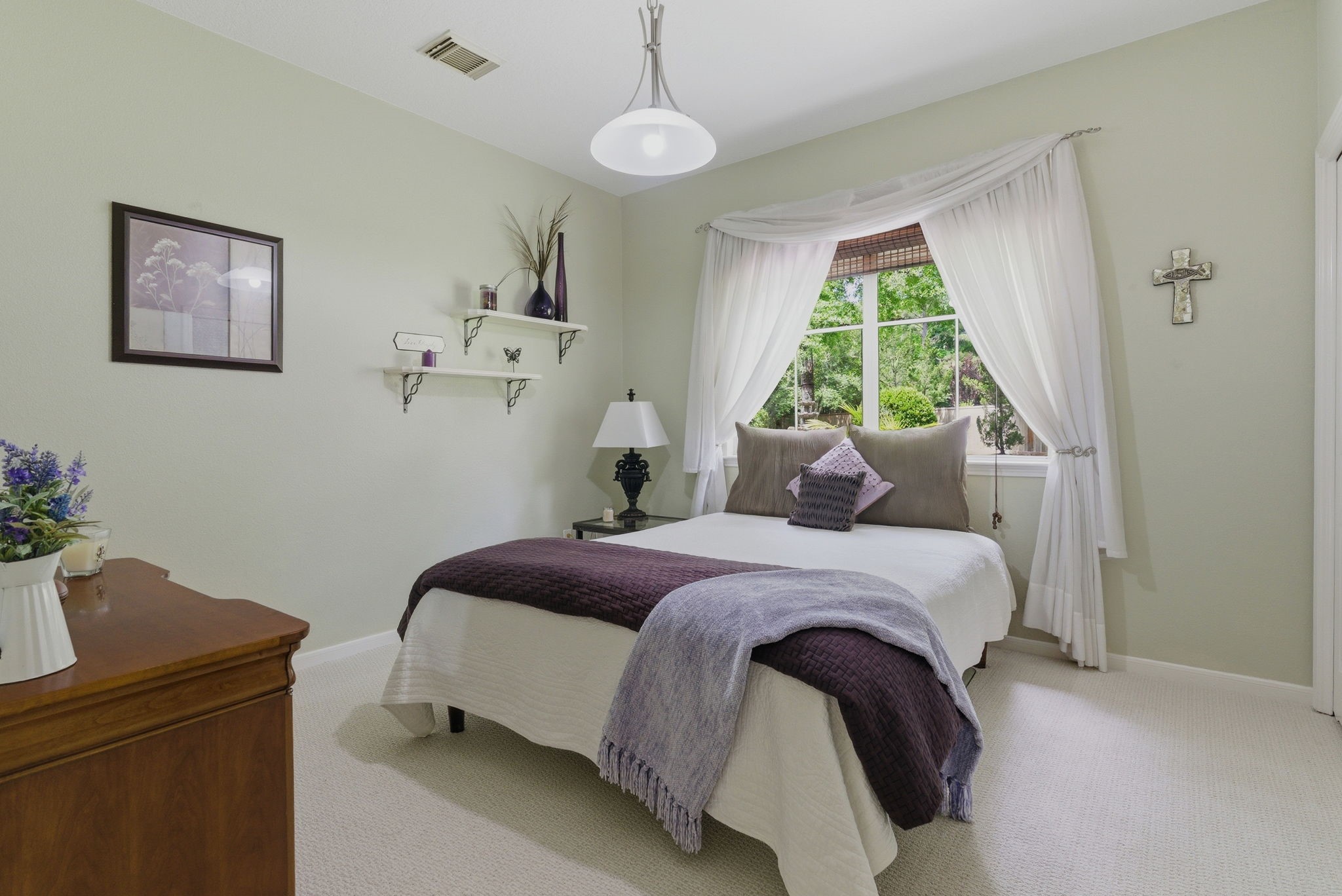 11 Dovewing Place Spring, TX 77382 - Photo 21 of 32 This cozy bedroom features a large window with elegant drapes, allowing natural light to brighten the space. Such a warm and inviting atmosphere.
