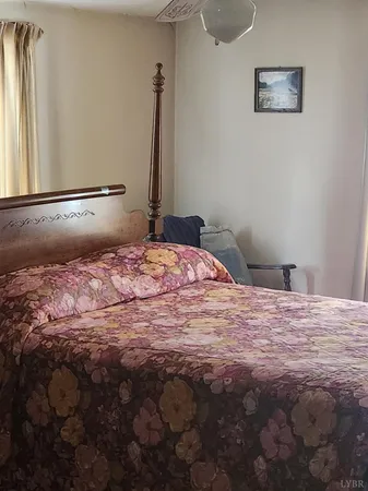 a view of walk in closet with clothes