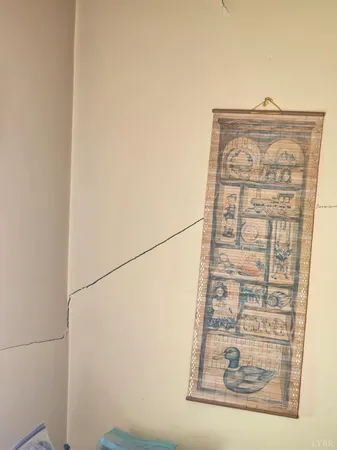 a wooden bench sitting in the middle of a yard