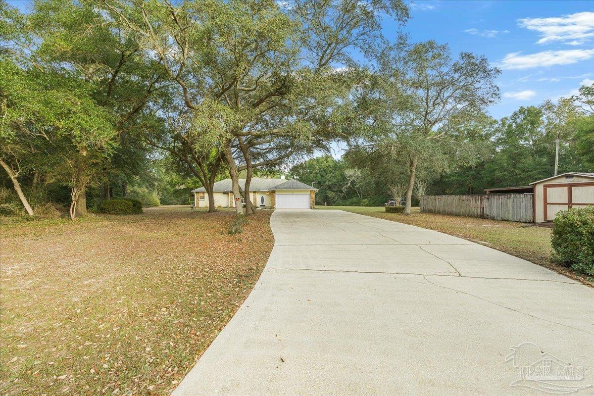6500 Winston Brown Road Milton, FL 32570 - Photo 1 of 43 a view of a backyard