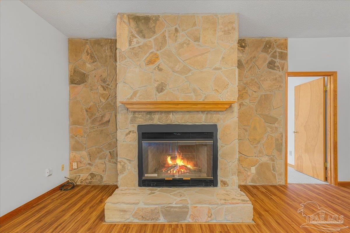 6500 Winston Brown Road Milton, FL 32570 - Photo 15 of 43 a living room with a fireplace