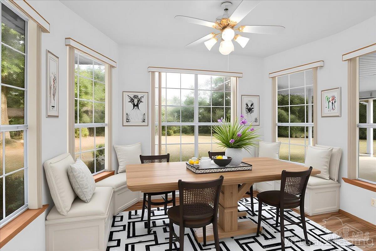 6500 Winston Brown Road Milton, FL 32570 - Photo 17 of 43 a view of a dining room with furniture window and outside view