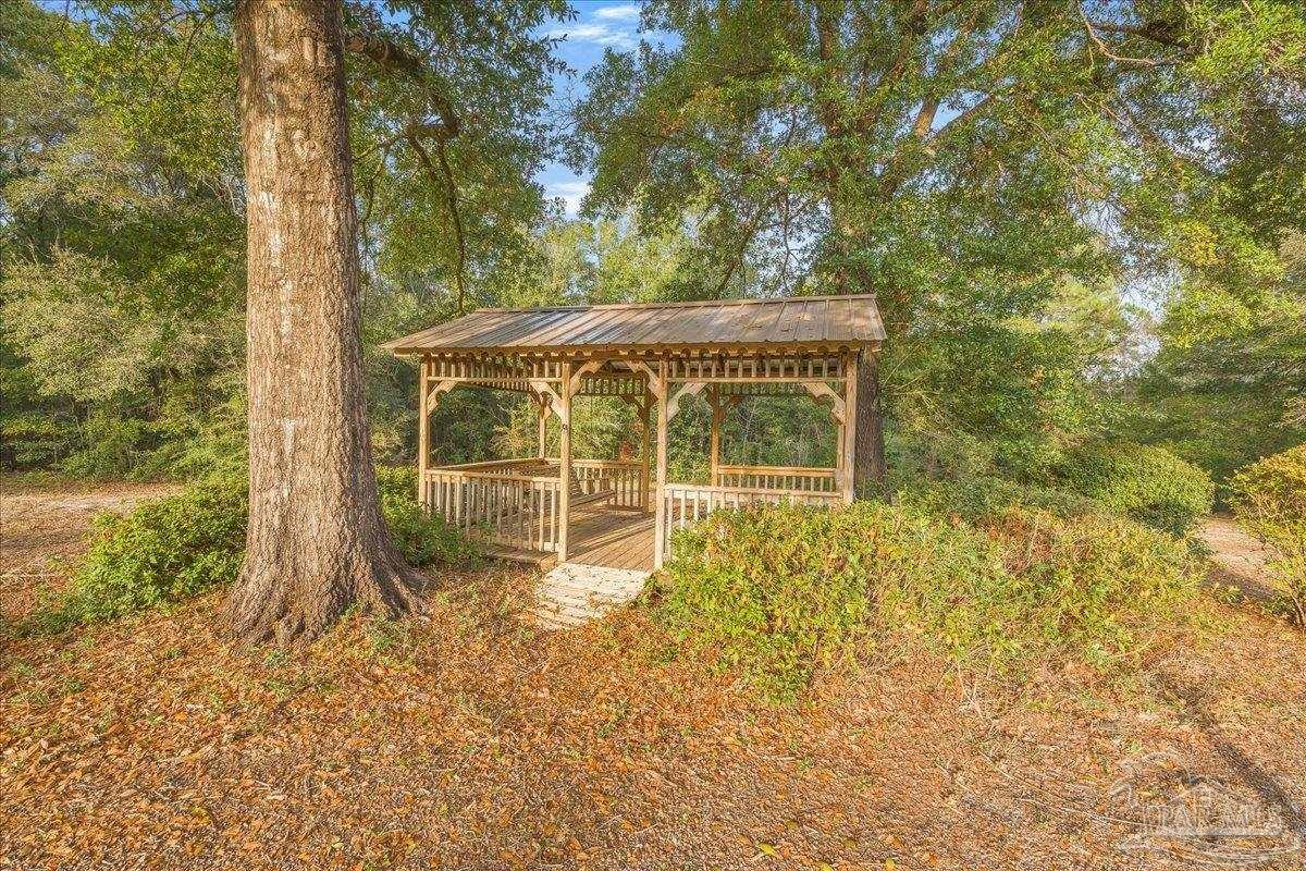 6500 Winston Brown Road Milton, FL 32570 - Photo 32 of 43 a view of a house with a tree