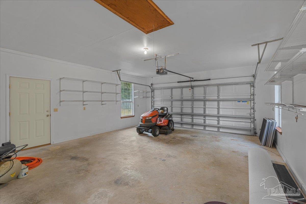6500 Winston Brown Road Milton, FL 32570 - Photo 37 of 43 a view of a garage with storage