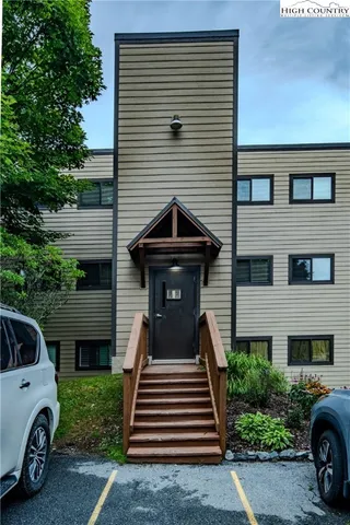 a view of a car parked in front of a house