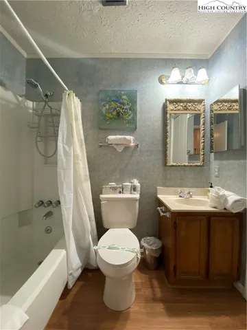 a kitchen with stainless steel appliances granite countertop a stove and a white cabinets