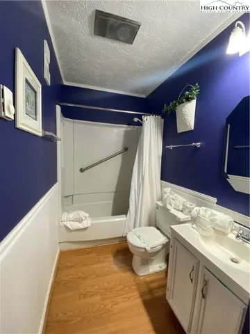 a bedroom with a bed and a lamp