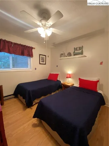a kitchen with stainless steel appliances white cabinets and a stove a sink