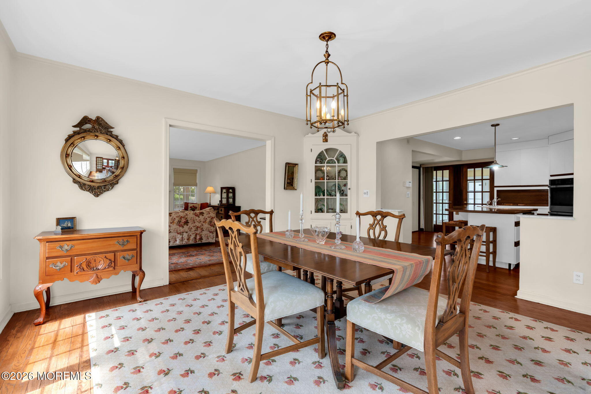 5 Howell Avenue Spring Lake, NJ 07762 - Photo 23 of 92 a view of a dining room and livingroom with furniture wooden floor and a chandelier