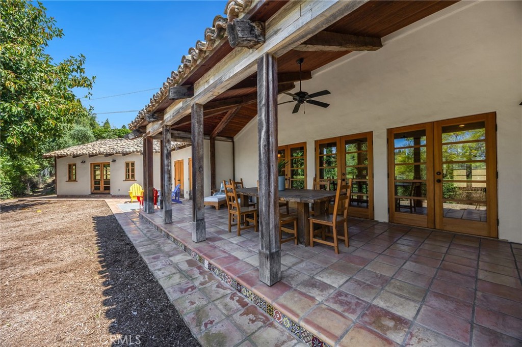 911 Laguna Road Fullerton, CA 92835 - Photo 14 of 68 a view of a dinning table and chairs in backyard of the house