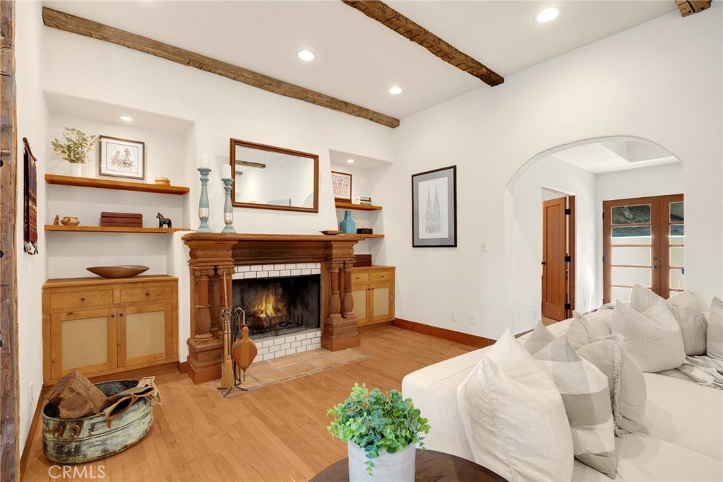 911 Laguna Road Fullerton, CA 92835 - Photo 32 of 68 a living room with furniture and a fireplace