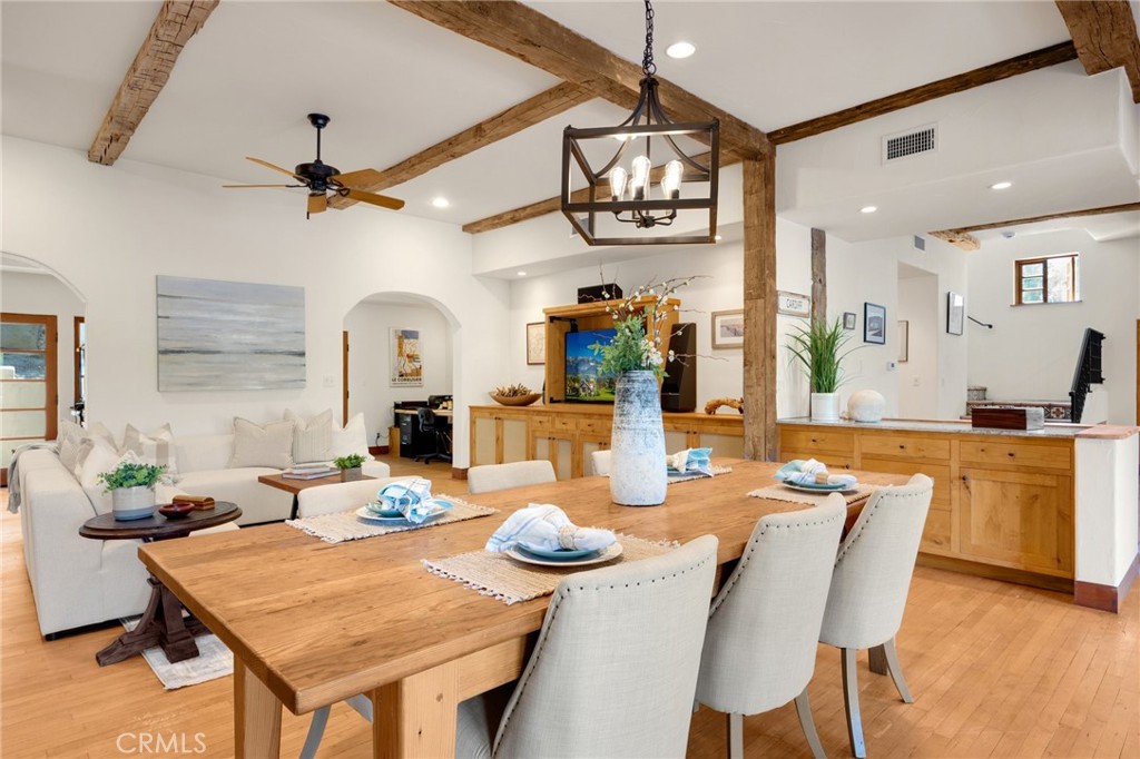 911 Laguna Road Fullerton, CA 92835 - Photo 35 of 68 a view of a dining room with furniture a chandelier and wooden floor