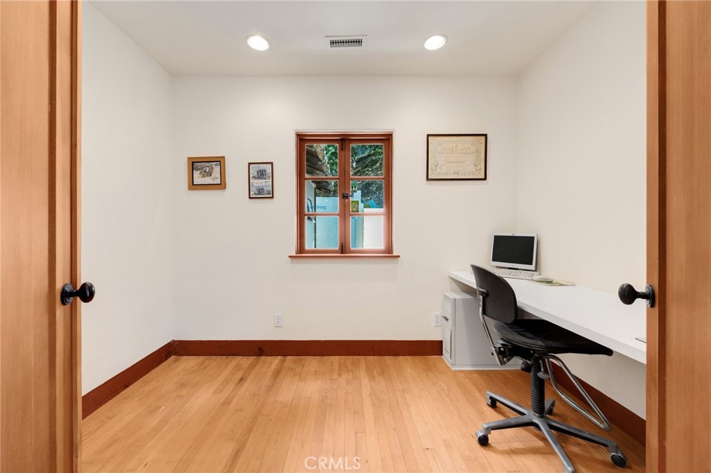 911 Laguna Road Fullerton, CA 92835 - Photo 43 of 68 a view of a workspace with furniture and wooden floor
