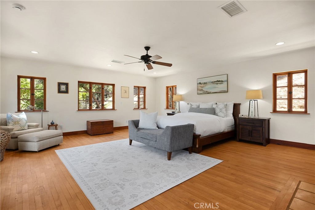 911 Laguna Road Fullerton, CA 92835 - Photo 45 of 68 a bedroom with furniture and a wooden floor