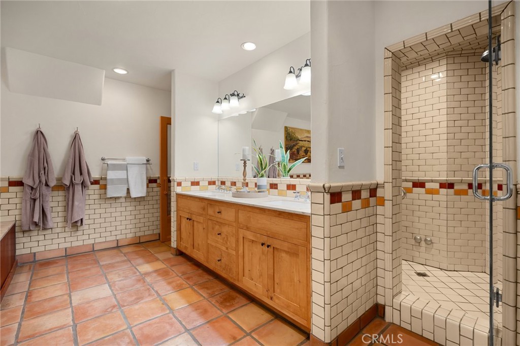 911 Laguna Road Fullerton, CA 92835 - Photo 47 of 68 a bathroom with double vanity and a shower