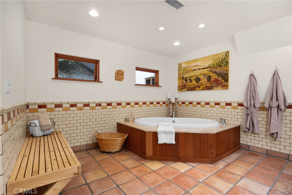 911 Laguna Road Fullerton, CA 92835 - Photo 49 of 68 a spacious bathroom with a bathtub and a shower