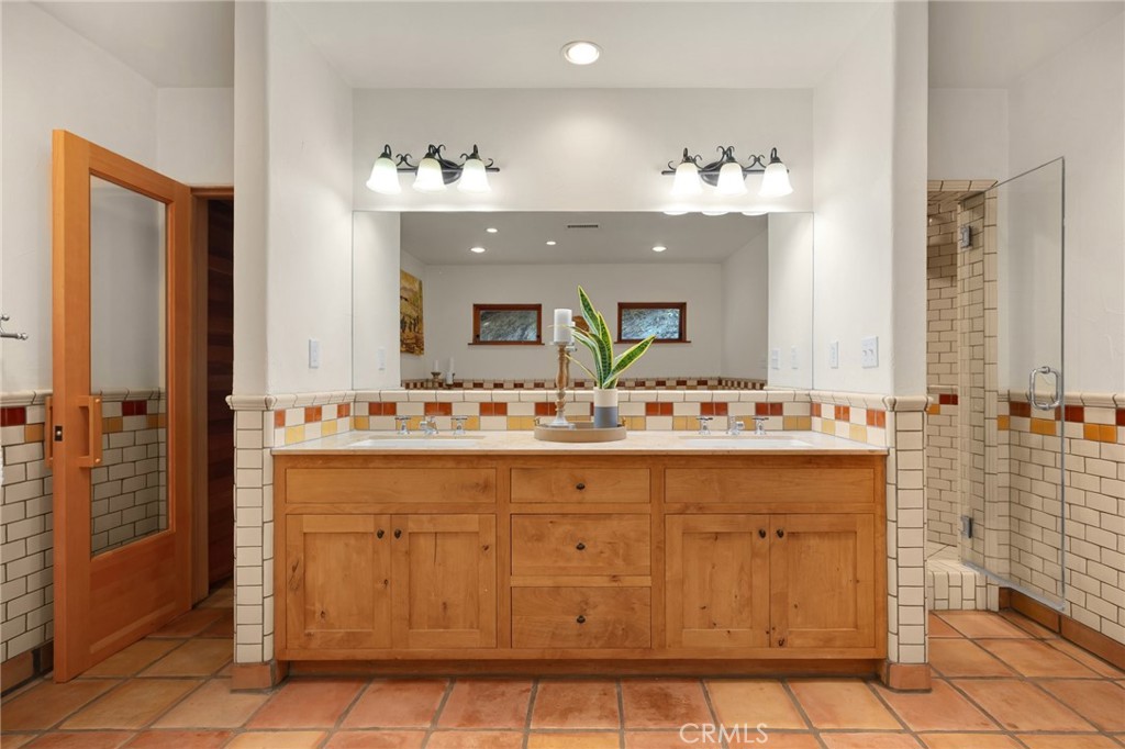 911 Laguna Road Fullerton, CA 92835 - Photo 50 of 68 a bathroom with a sink vanity and a mirror