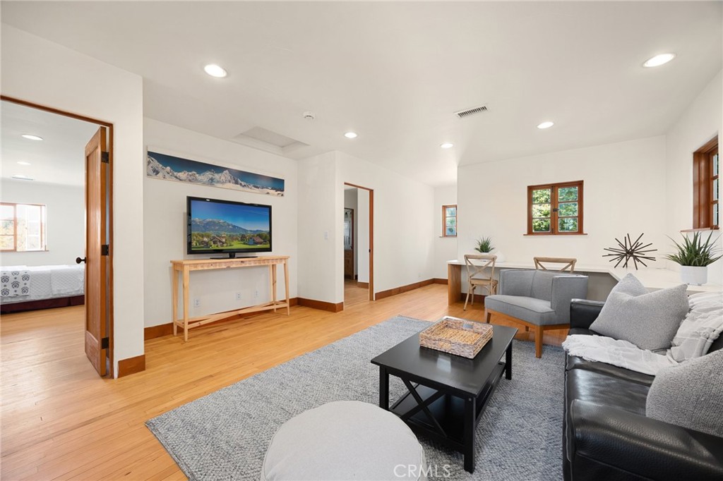 911 Laguna Road Fullerton, CA 92835 - Photo 54 of 68 a living room with furniture and a wooden floor