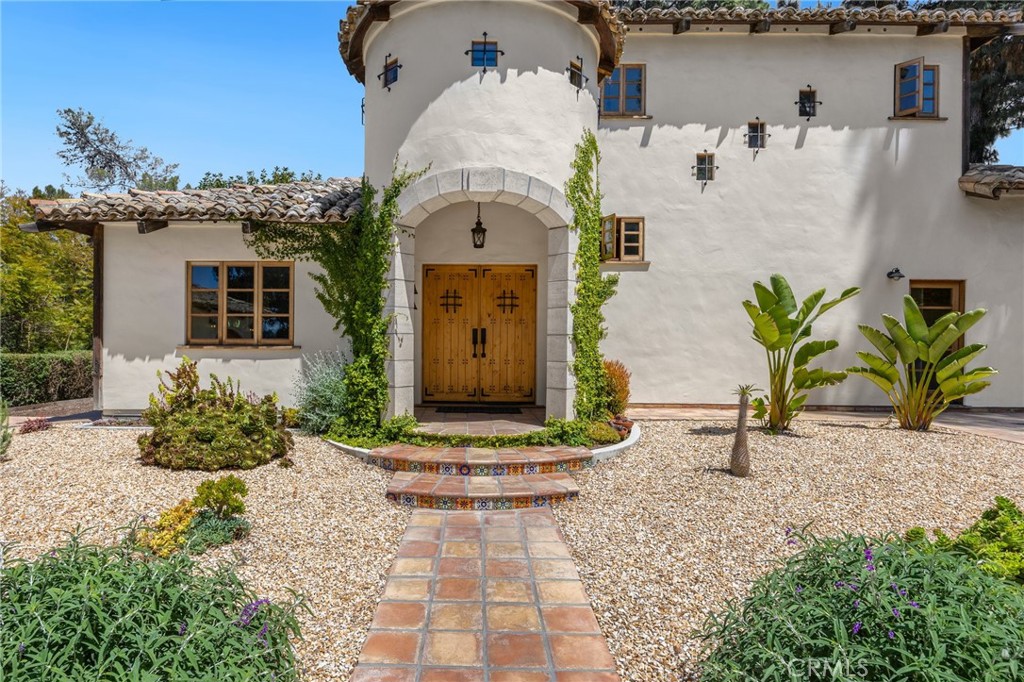 911 Laguna Road Fullerton, CA 92835 - Photo 6 of 68 a front view of a house with garden