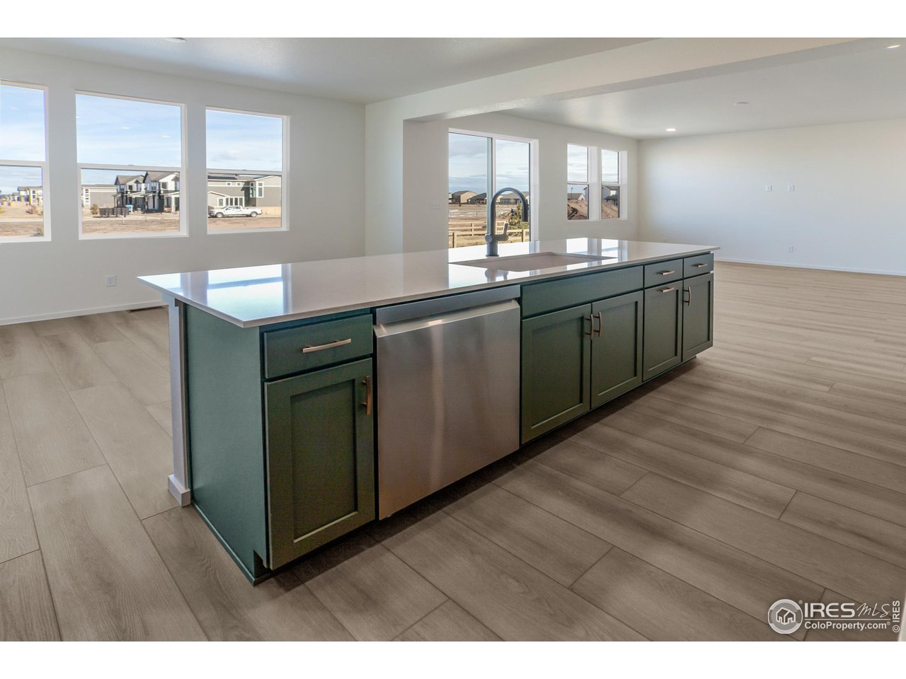 6108 Gault Road Timnath, CO 80547 - Photo 13 of 50 KITCHEN OPEN TO DINING AND LIVING ROOM