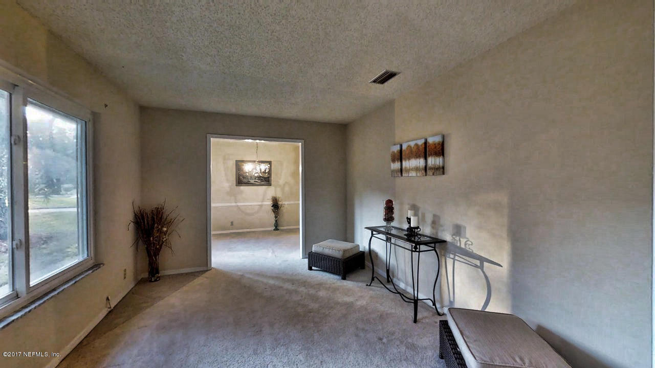 14061 Tomaka Road Jacksonville, FL 32225 - Photo 4 of 32 Living Room 2